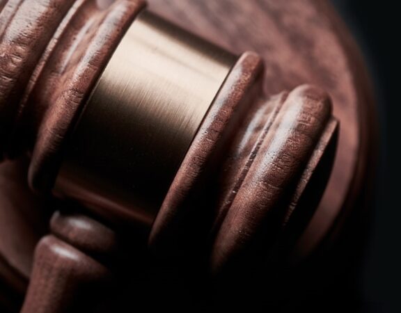 Close-up photograph of a wooden judge's gavel.