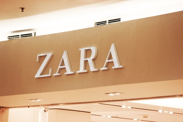 Photograph of the "ZARA" trademark in a sign above a Zara storefront.