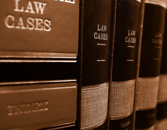 Legal textbooks on a shelf