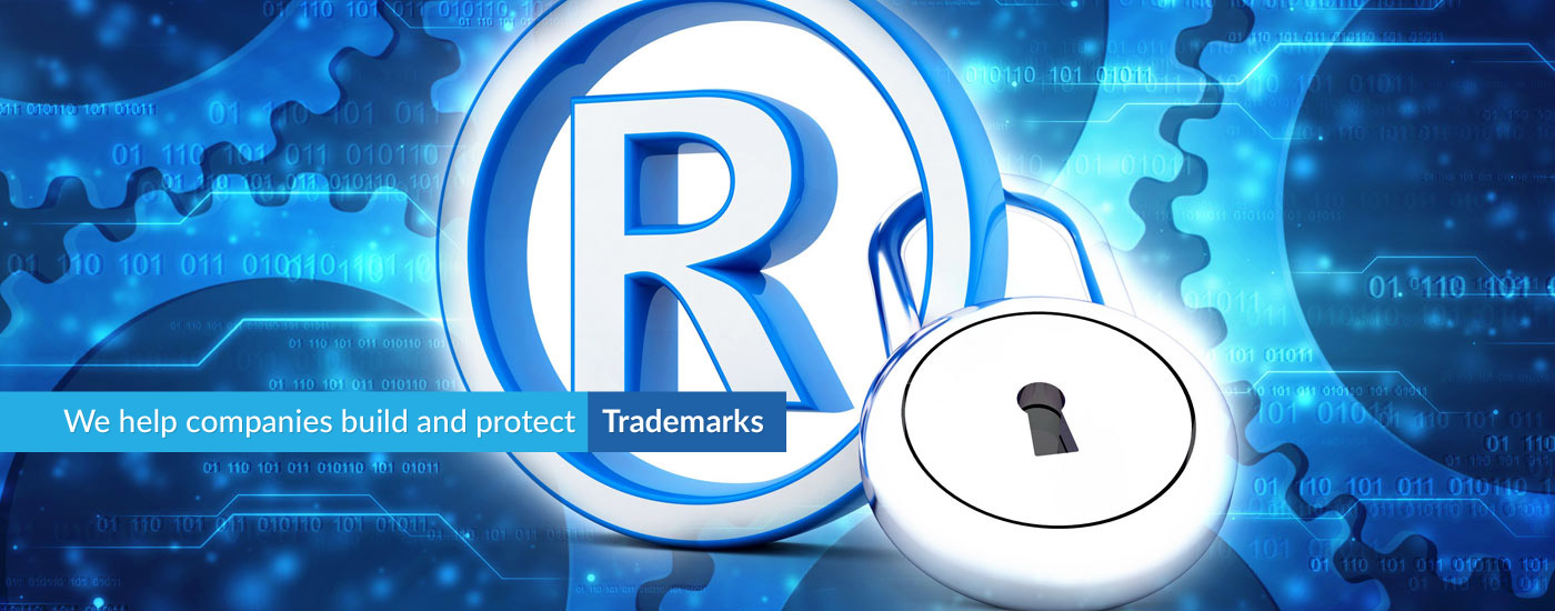 Picture of the (R) symbol with text overlay reading "We help companies build and protect trademarks"