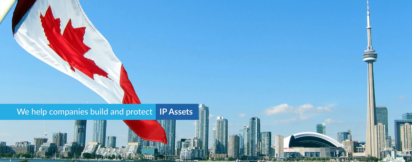 Photograph of the Toronto skyline with text overlay reading "We help companies build and protect IP Assets"