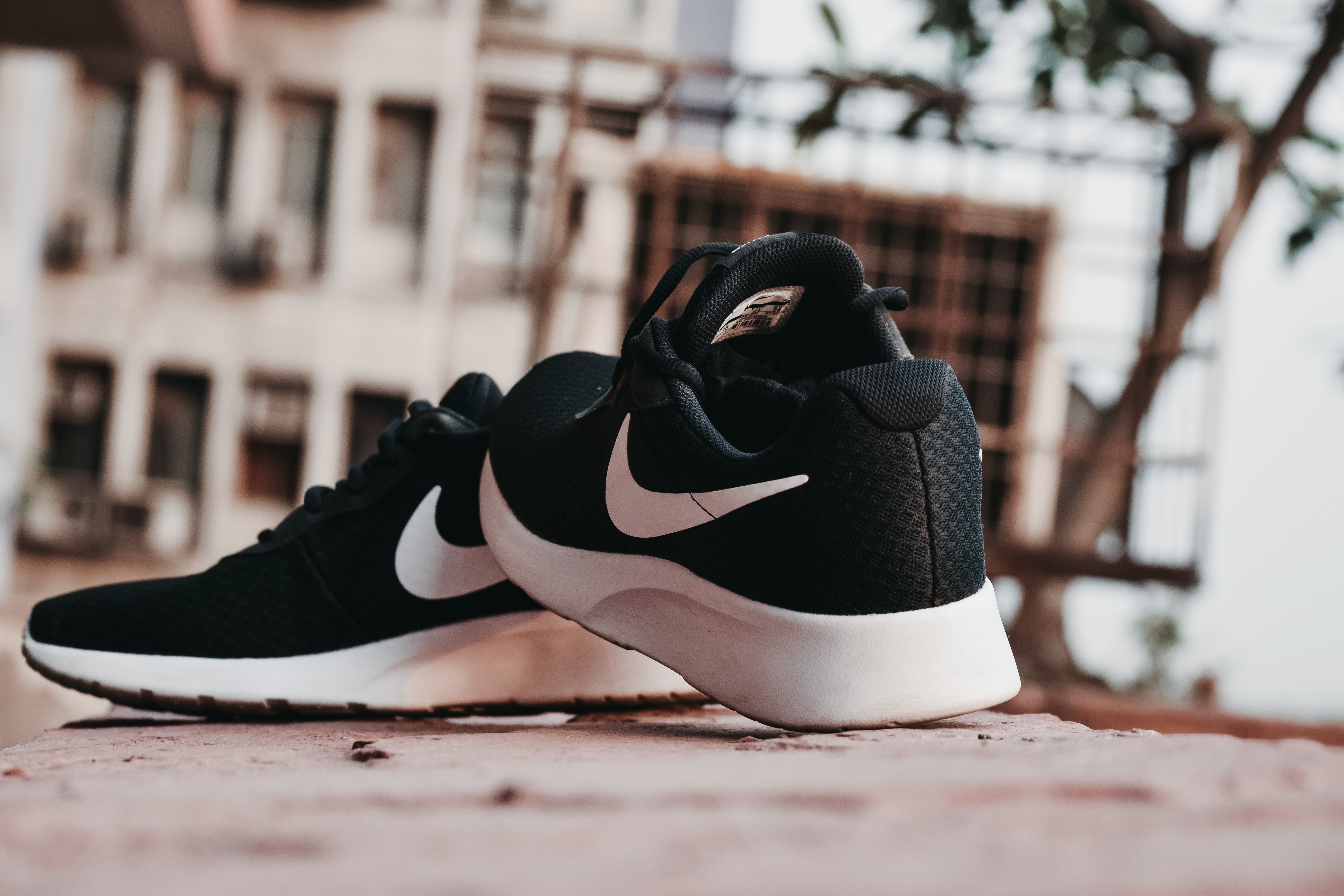 Pair of black and white Nike running shoes