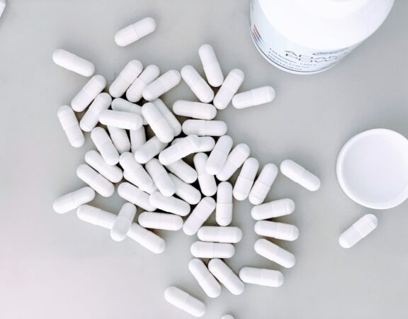 Photograph of white pills containing a natural health product